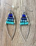 Handmade Wire Wrapped Turquoise Beaded Earrings on table 
