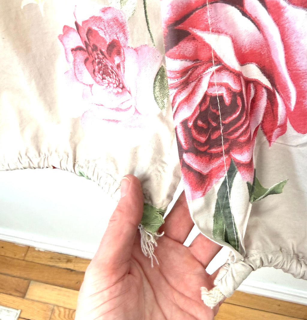 Hem of Italian boutique rose print jacket cottagecore aesthetic spring layering piece showing drawstring 