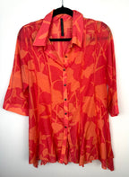 IC by Connie K Silk Blend Blouse in coral and orange on hanger