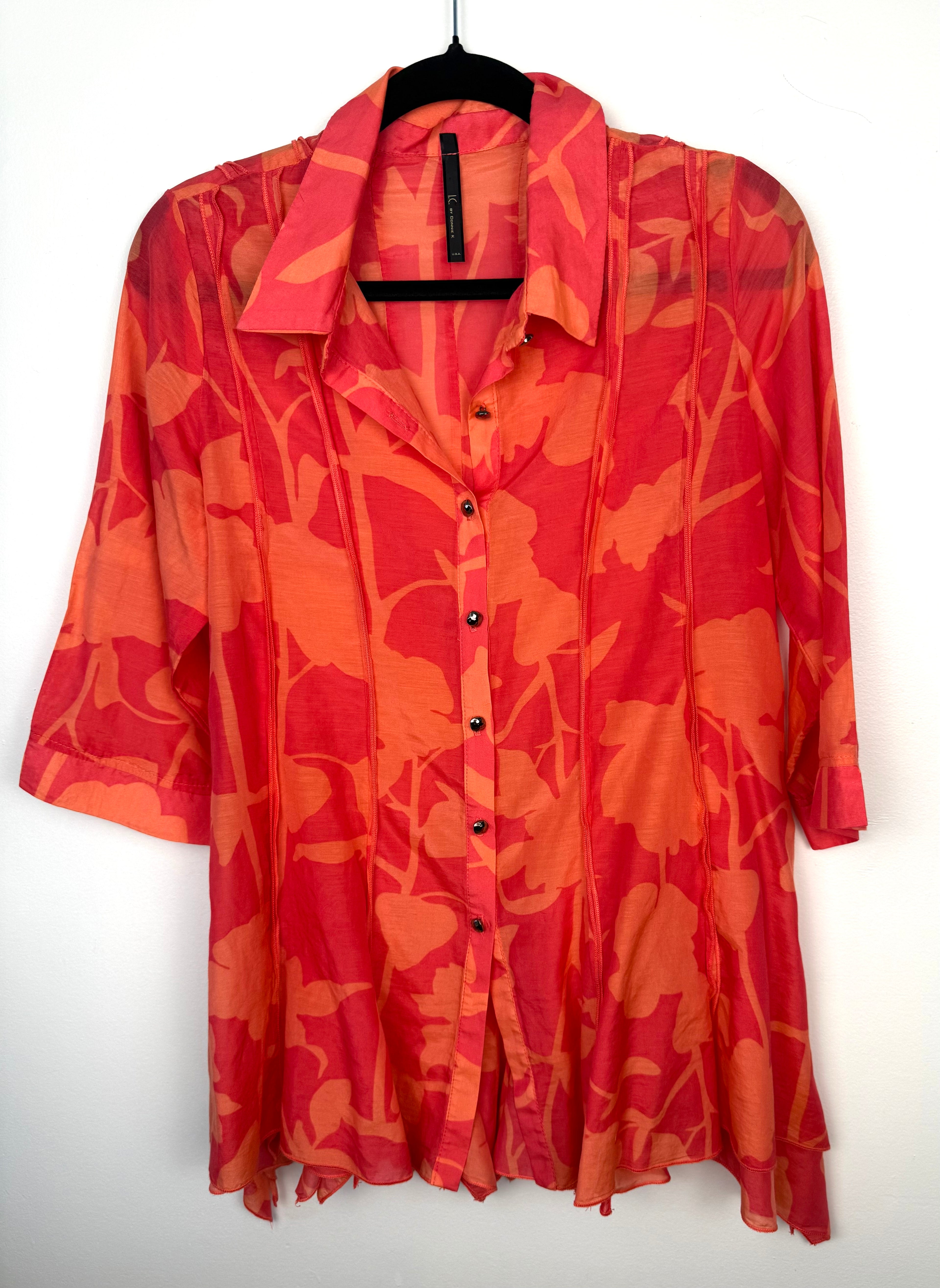 IC by Connie K Silk Blend Blouse in coral and orange on hanger