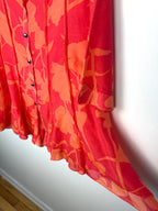 IC by Connie K Silk Blend Blouse in coral and orange showing hem flow 