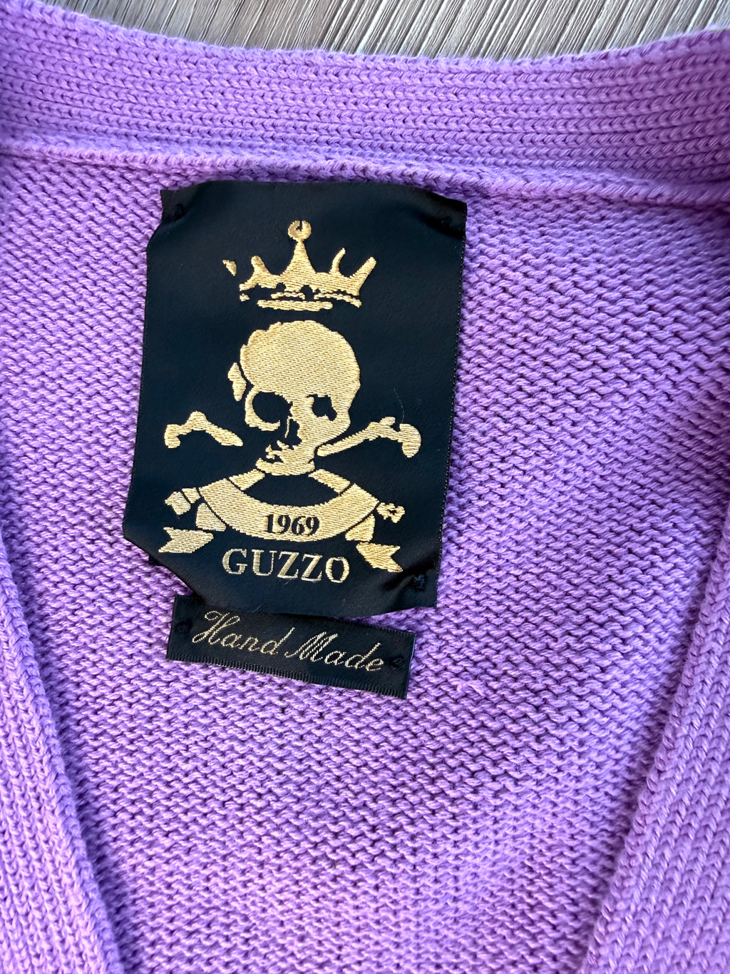 Inside tag  on  Guzzo 1969 handmade lilac cable knit cardigan XXL UK made cotton sweater with yellow and black stripe detail