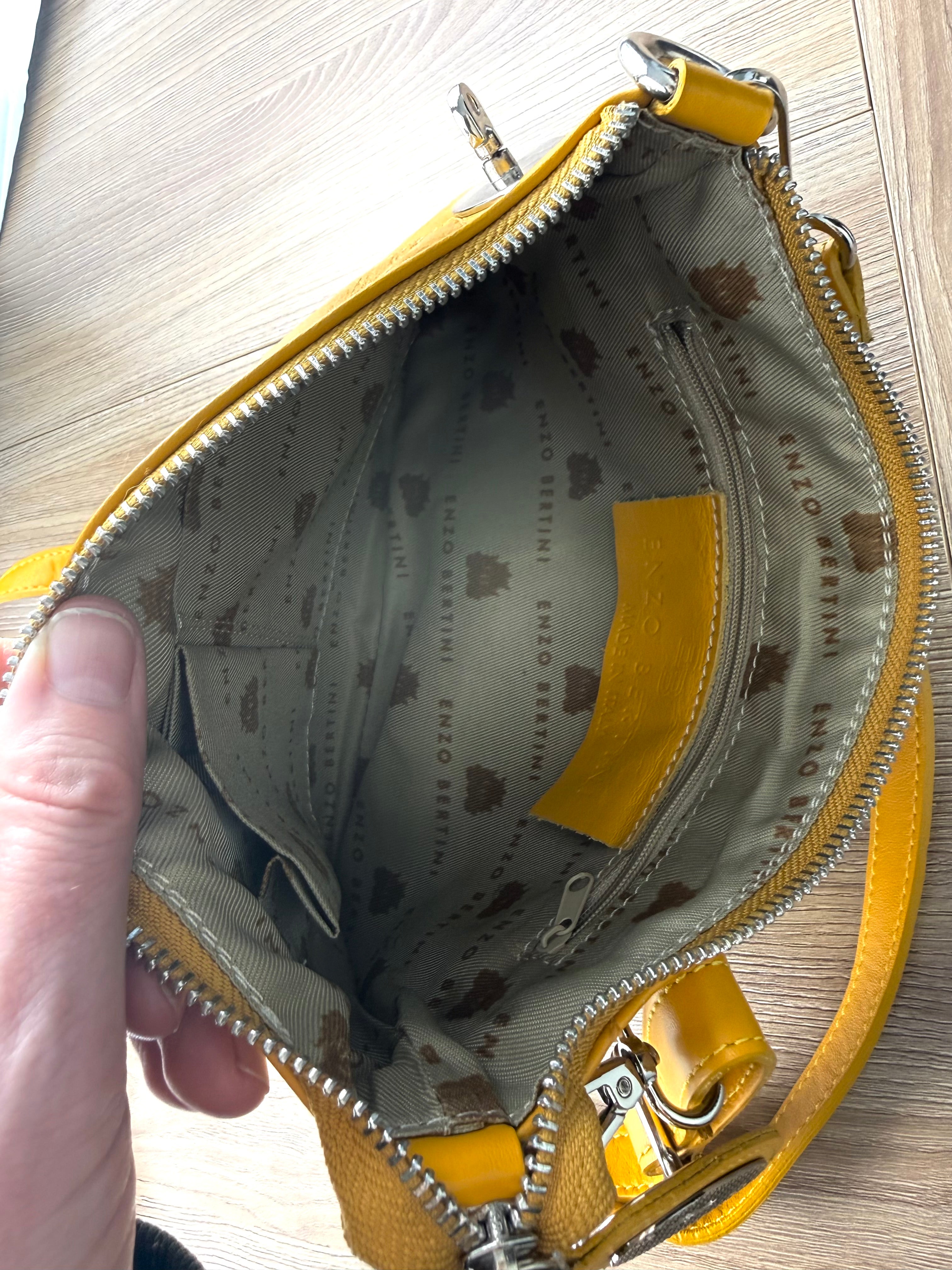 Interior of Enzo Bertini Made in Italy leather bag with branded lining and zip pocket