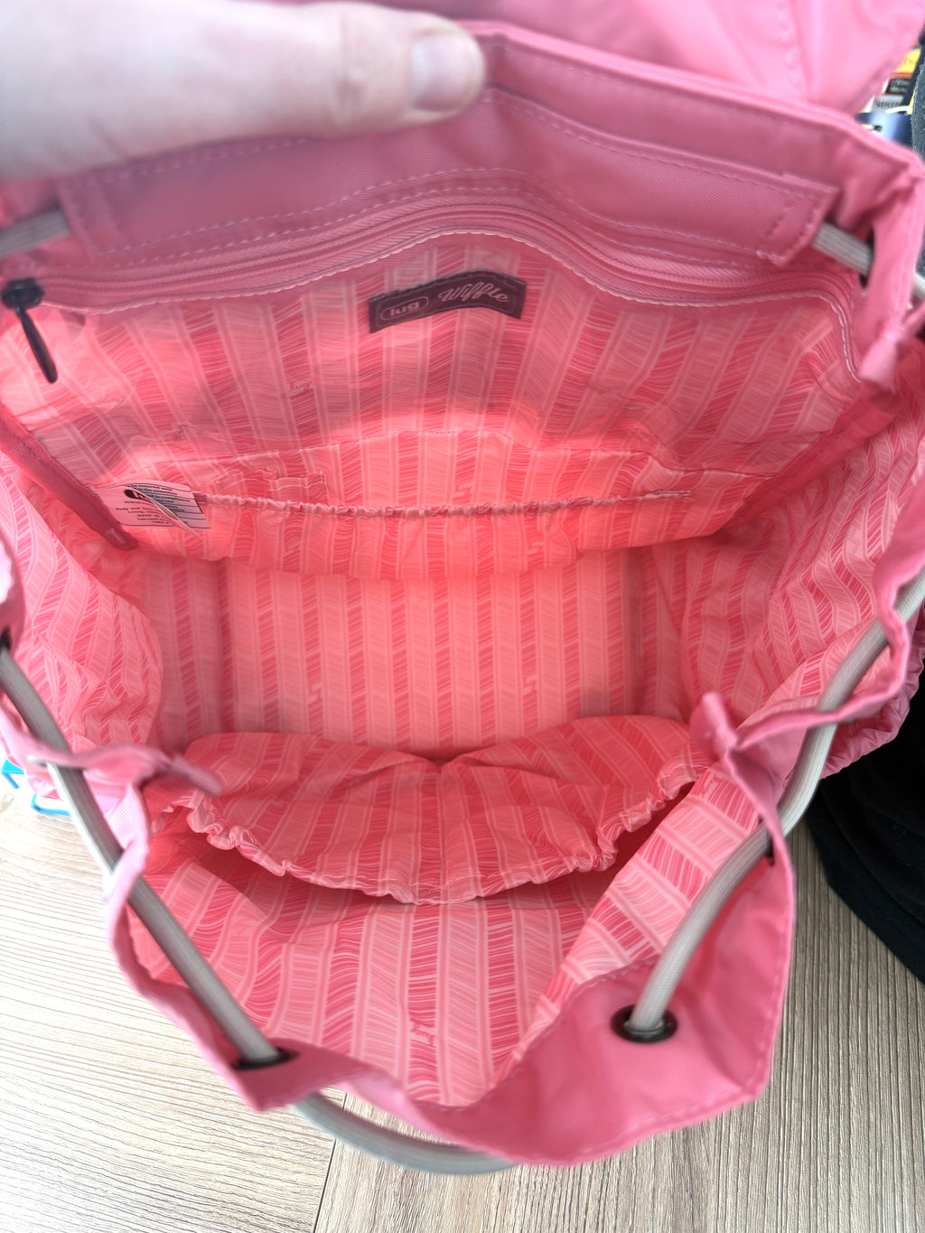 Interior of Lug Wiffle backpack with striped lining and compartments