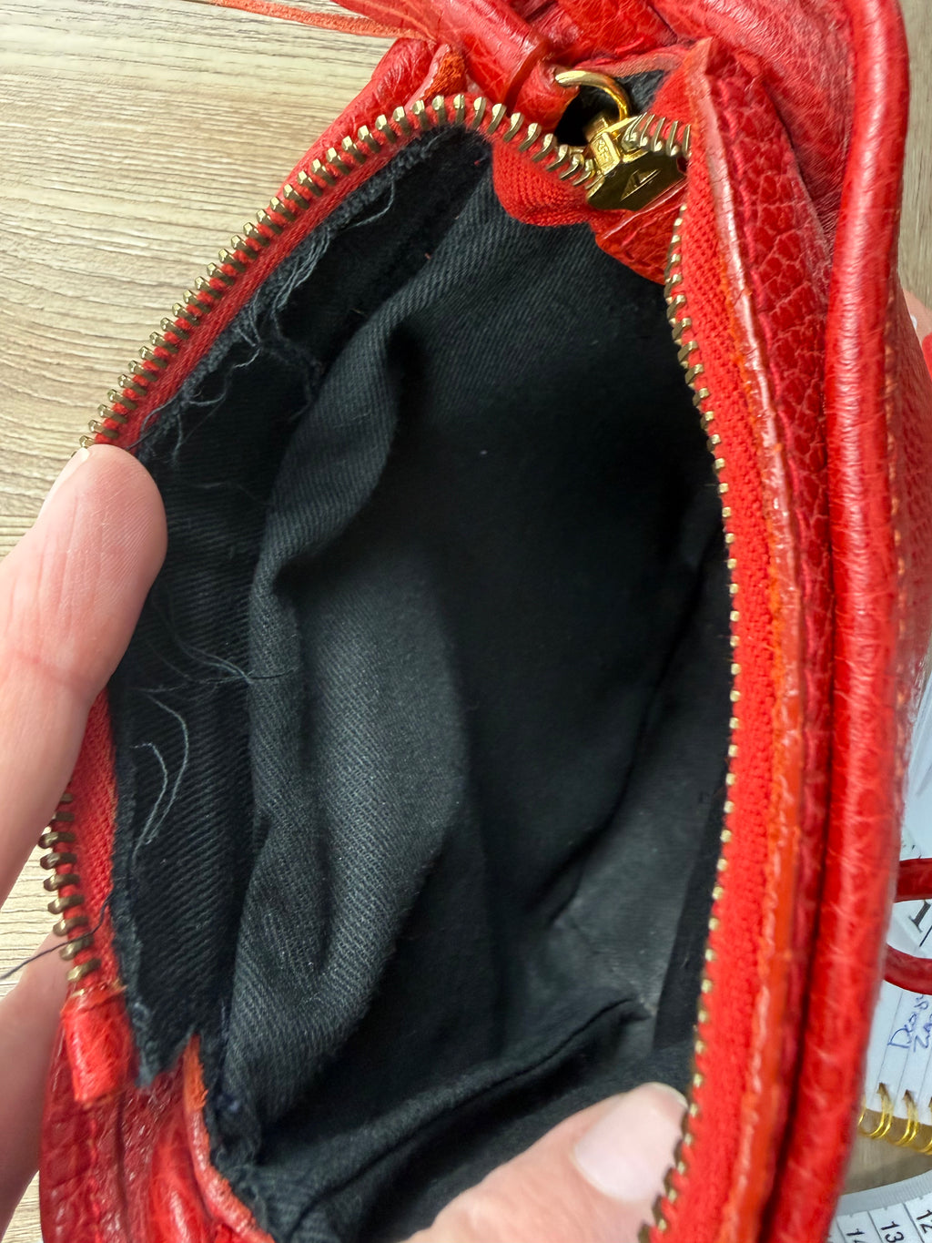 Inside of Laurentian Chief red leather purse showing lined interior
