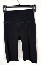 Kit and Ace black high-waist biker shorts on hanger 