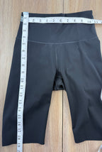 Kit and Ace black high-waist biker shorts measuring 22" waist and 19" length 
