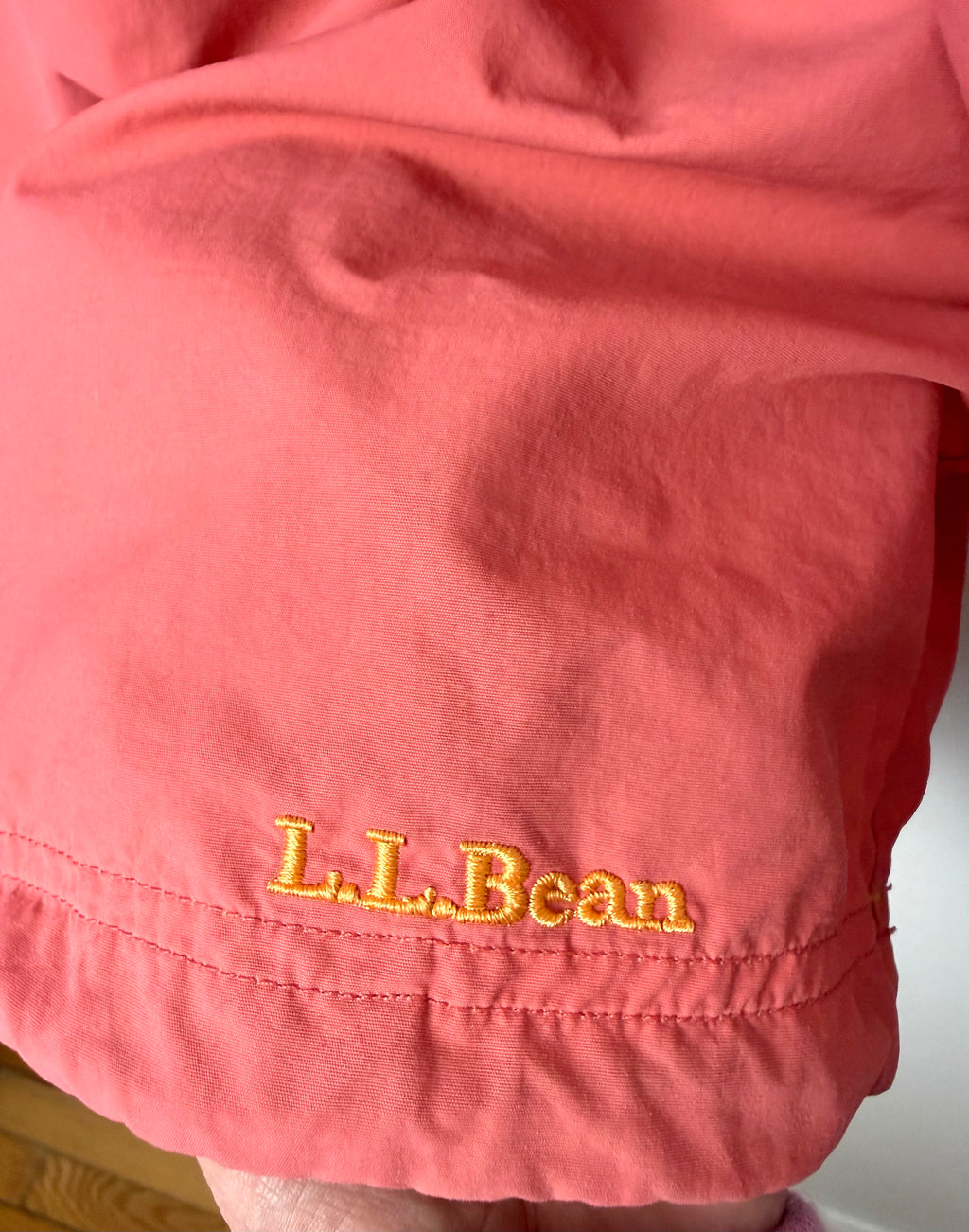 LL Bean anorak jacket in coral and orange emblem on hem