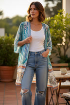 Laura Paisley Kimono Cardigan | Blue Turquoise Boho Cover Up | Medium at Blue Sparrow Shop  on woman outside wearing distressed jeans and a white tank top