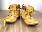 Laurentian Chief Leather Moccasins Made in Canada Leather Moccasins on desk