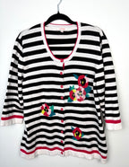 Le Greneir French girl style sweater in black and white stripe with floral sequinned pattern on hanger