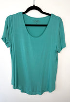 front of Leave Nothing But Footprints Bamboo Tee | Size M in tiffany blue  on hanger
