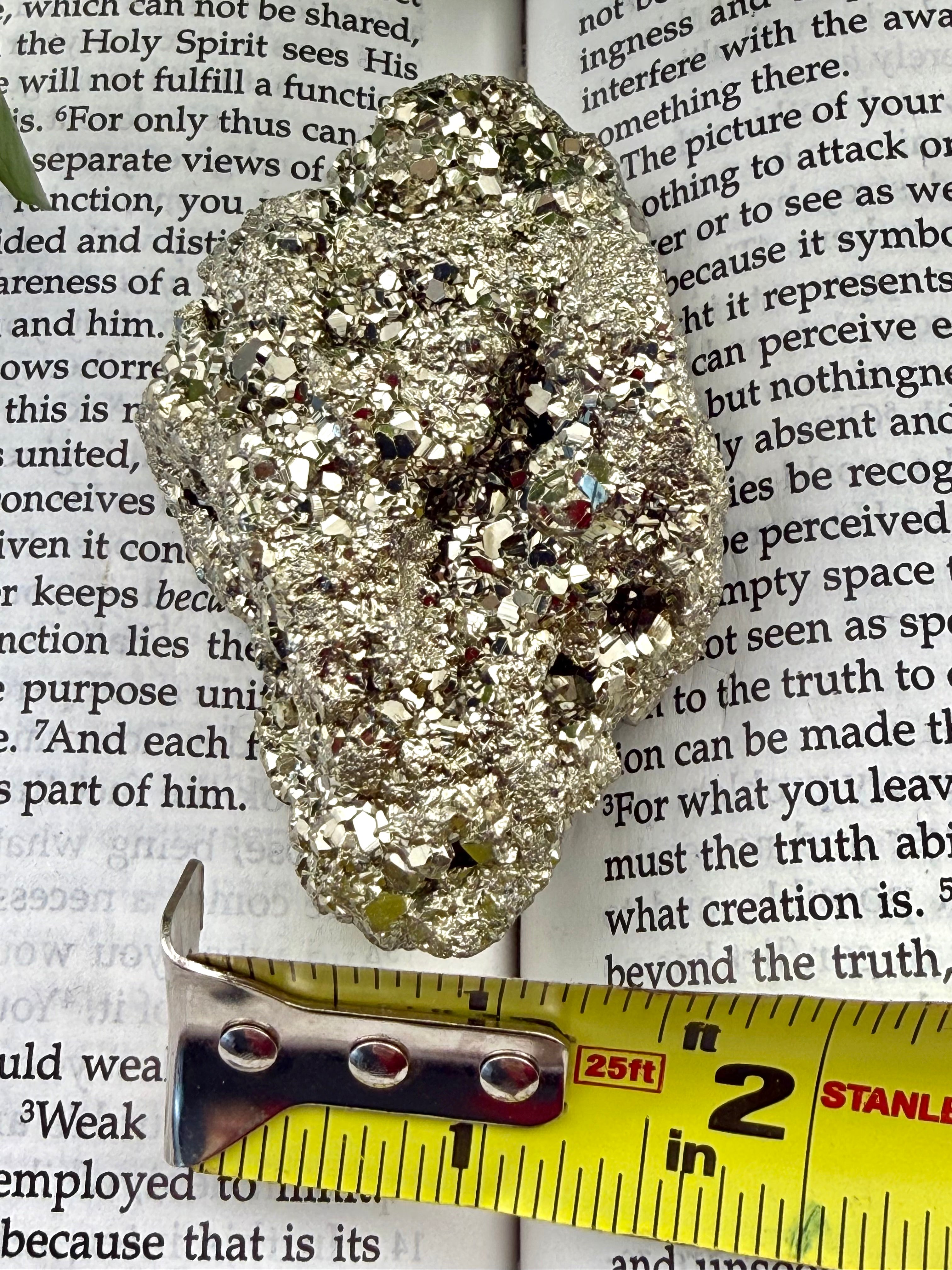 Pyrite with measuring tape showing it to be about 1.5=2" wide 