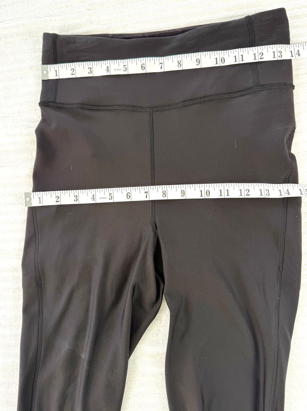 Lululemon Black High Waisted Leggings | Size 8 at Blue Sparrow Shop measuring 28" waist and 30" hips 