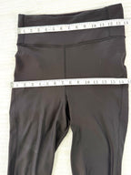Lululemon Black High Waisted Leggings | Size 8 at Blue Sparrow Shop measuring 28" waist and 30" hips 