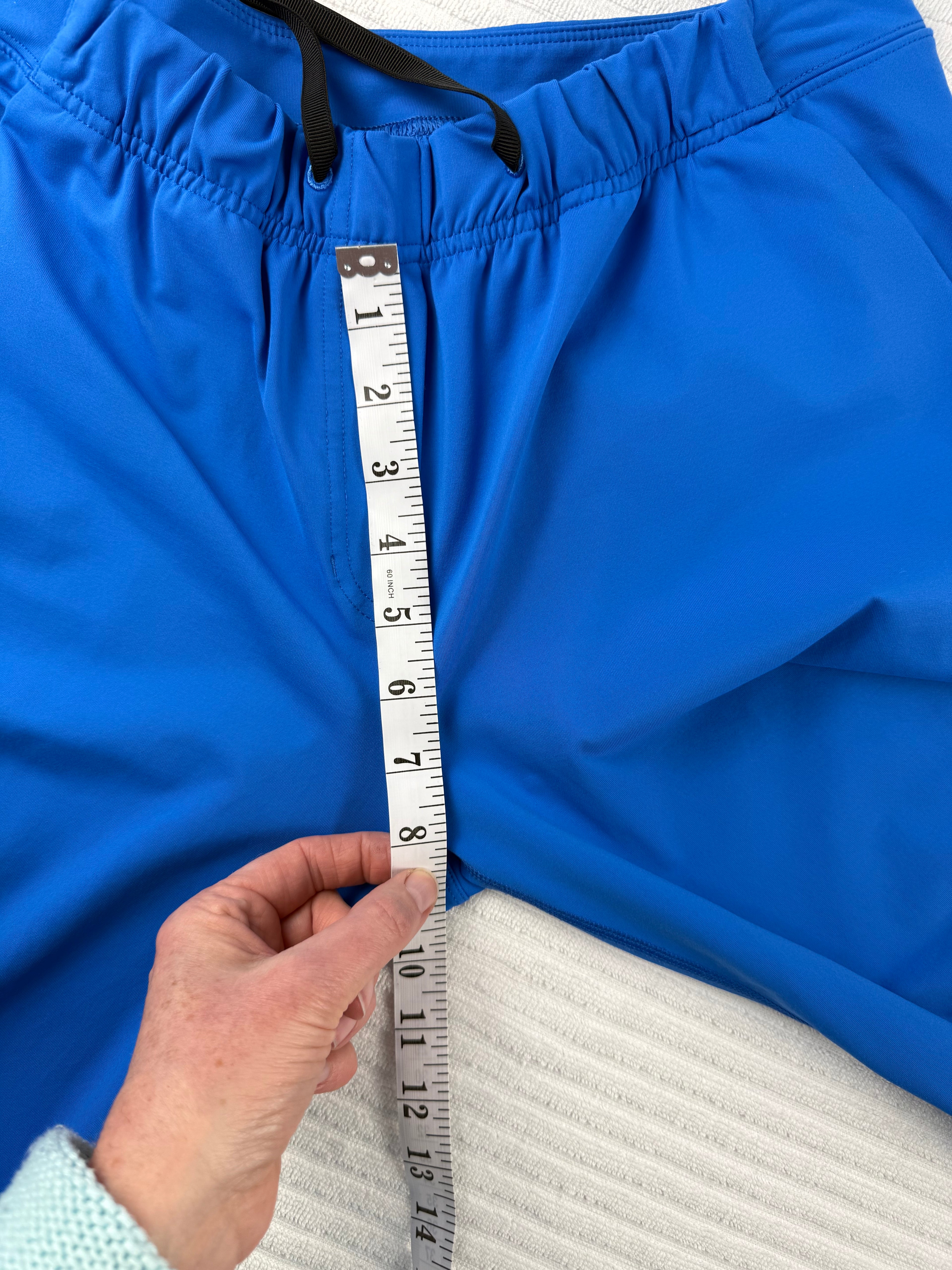 Lululemon Cobalt Blue Tapered Drawstring Pant, Size 8 | Blue Sparrow Resale Reimagined measuring 9" rise 