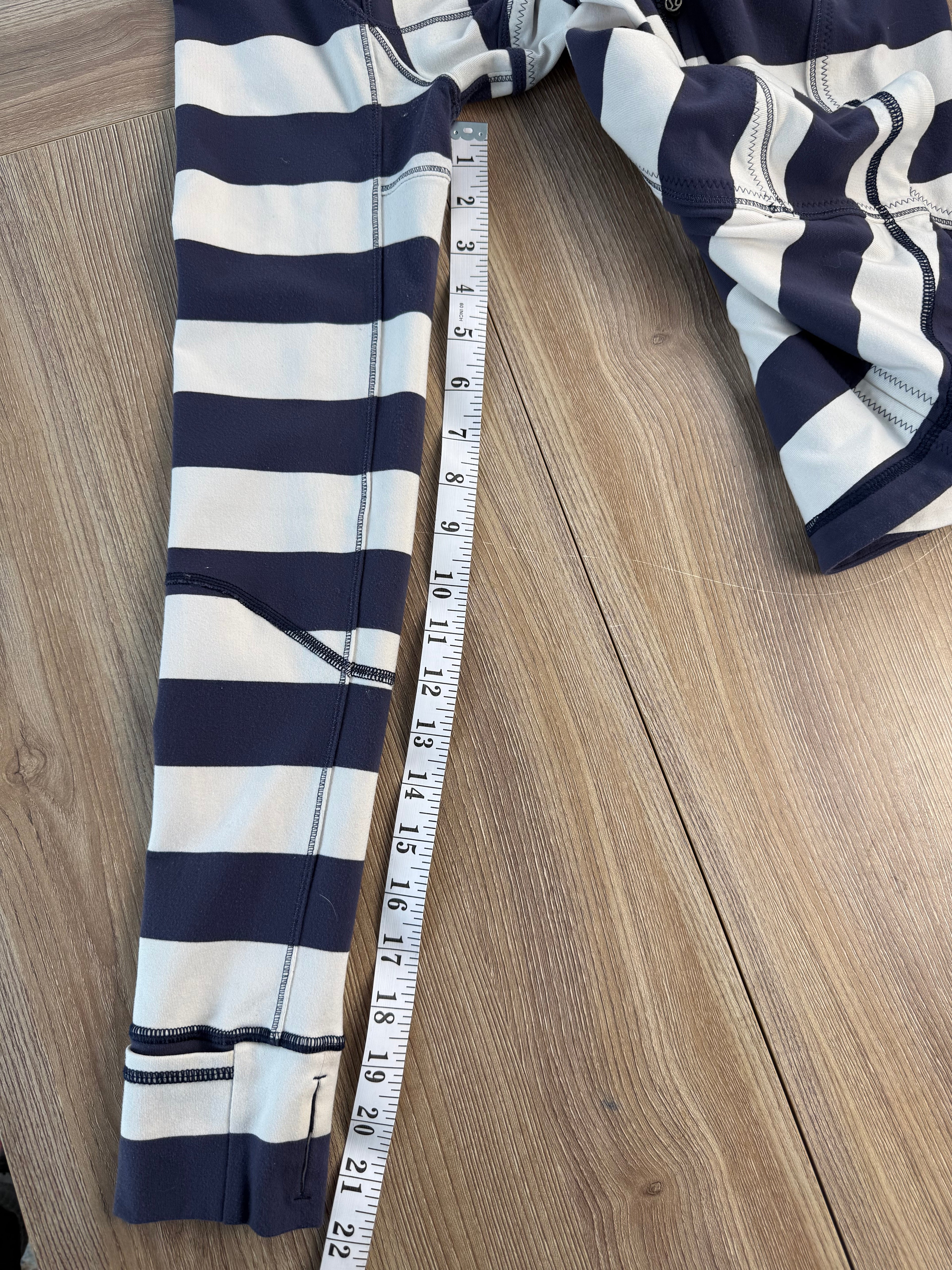 Lululemon Striped Zip up sweater measuring 22" sleeve length