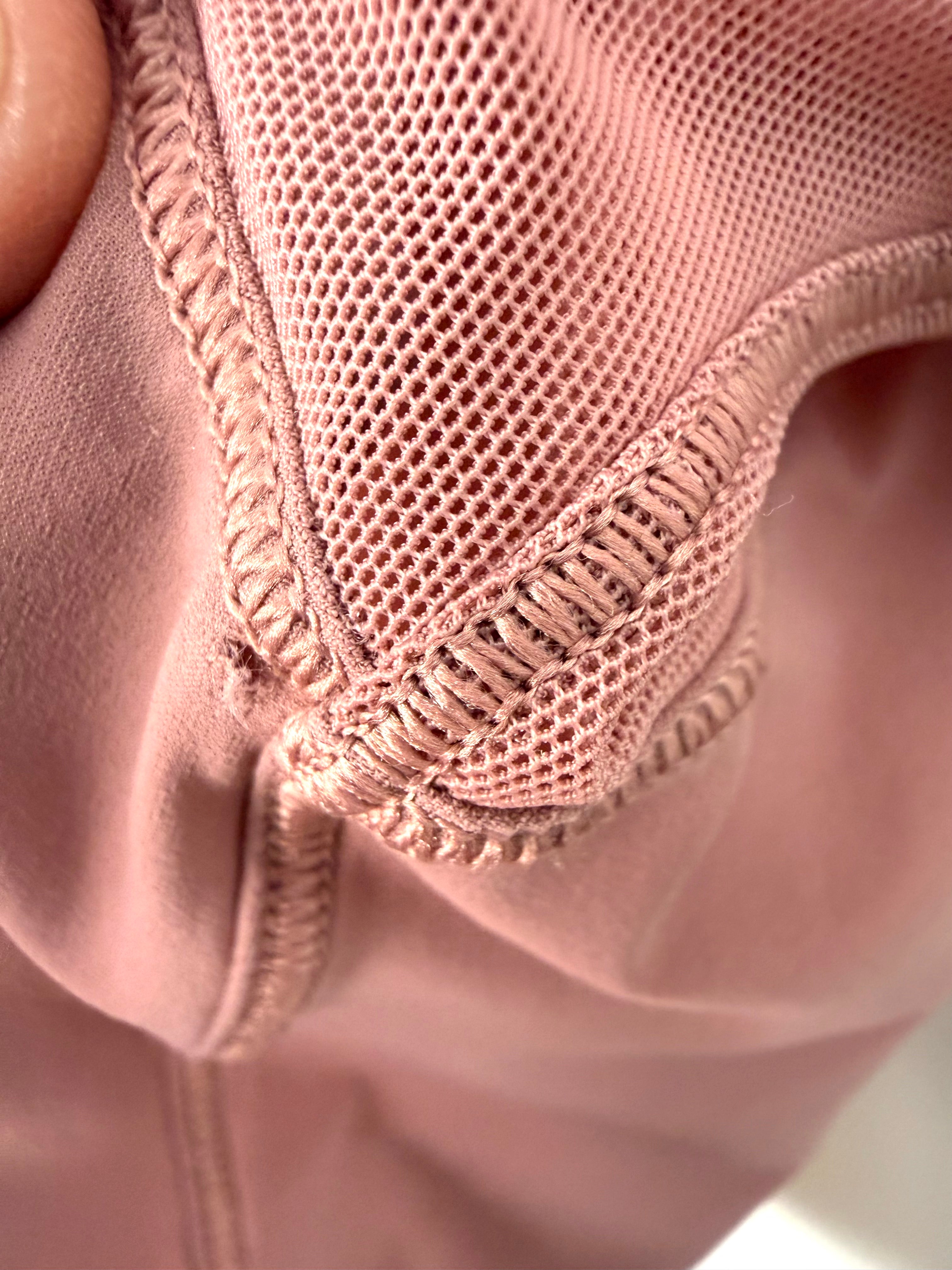 Lululemon interior seam detail dusty rose workout top. See tiny hole from price tag