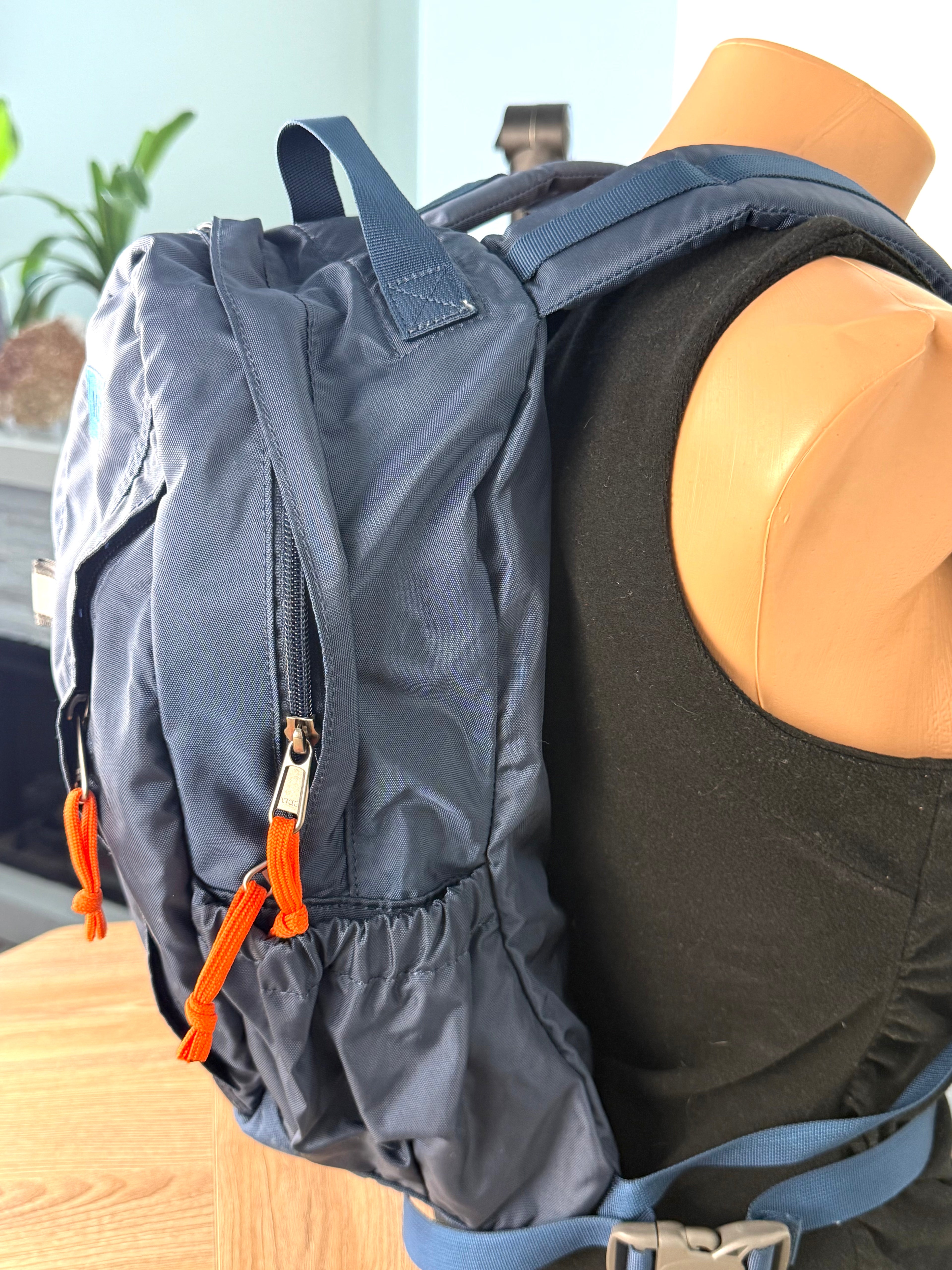 MEC Daypack Backpack 16L Lightweight Hiking Travel Blue on mannequin for scale 