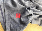 MEC emblem at hem of inside tag on  MEC Mountain Equipment Company athletic racerback tank 