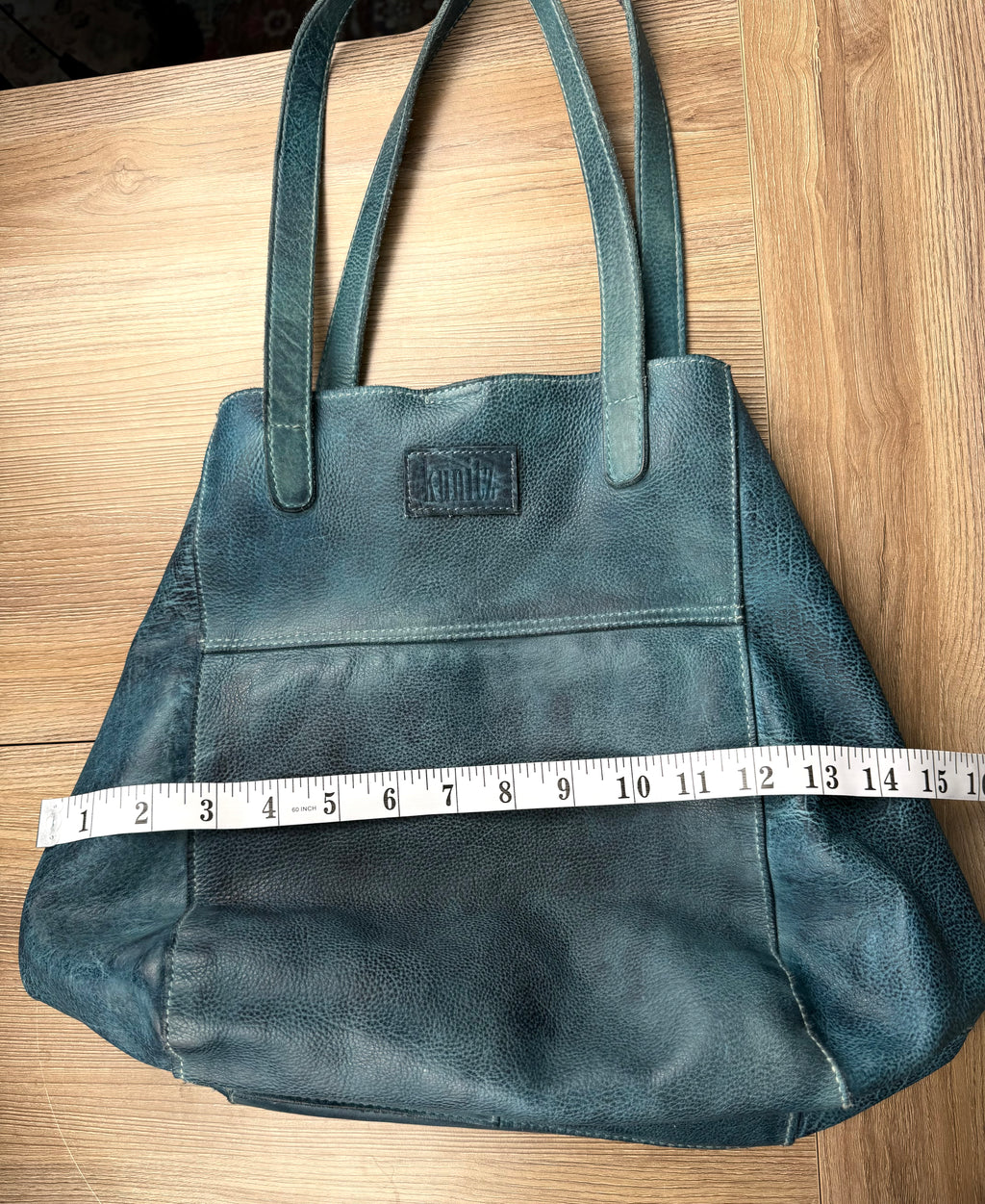 Made in Canada  Kunitz handcrafted leather tote bag measuring approx 14" wide when it folds in on itself when you carry it 