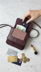 made in canada Vintage Leatherworks Crossbody Bag lifestyle shot with money and lipstick