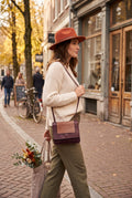 Vintage Leatherworks Crossbody Bag on woman walking outside