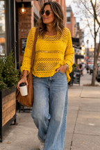 Maje Crochet Knit Sweater at Blue Sparrow Shop on woman walking with coffee outside 