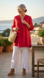 Marks & Spencer Autograph Cotton Silk Pintuck Tunic — Cyclamen Pink | 3/4 Sleeve | UK 20 (CDN 2X/18-20) at Blue Sparrow Shop on woman wearing white linen pants standing outside on a patio 