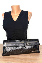 Matt & Nat Black Vegan Leather Clutch Bag on mannequin to show scale