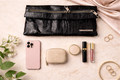 Matt & Nat Black Vegan Leather Clutch Bag at Blue Sparrow Shop with makeup, phone