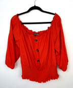 Melanie Lyne orange peasant blouse on hanger