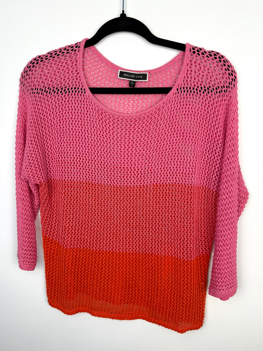 Melanie Lyne pink and red colourblock open knit sweater lightweight mesh pullover front view on hanger