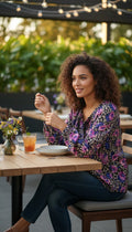 Mexx 100% Cotton Floral Leopard Mixed Print Blouse — Purple, Violet and Black | Peasant Style | Size L (US 14) at Blue Sparrow Shop on woman at outdoor table drinking iced tea 