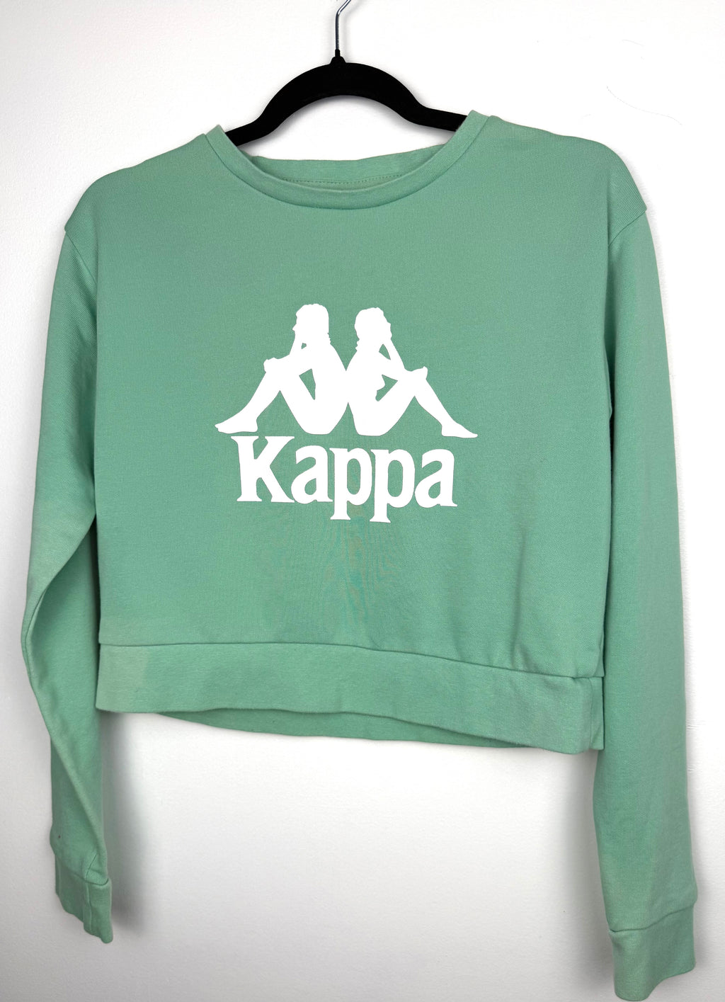 Mint green Kappa cropped sweatshirt on hanger