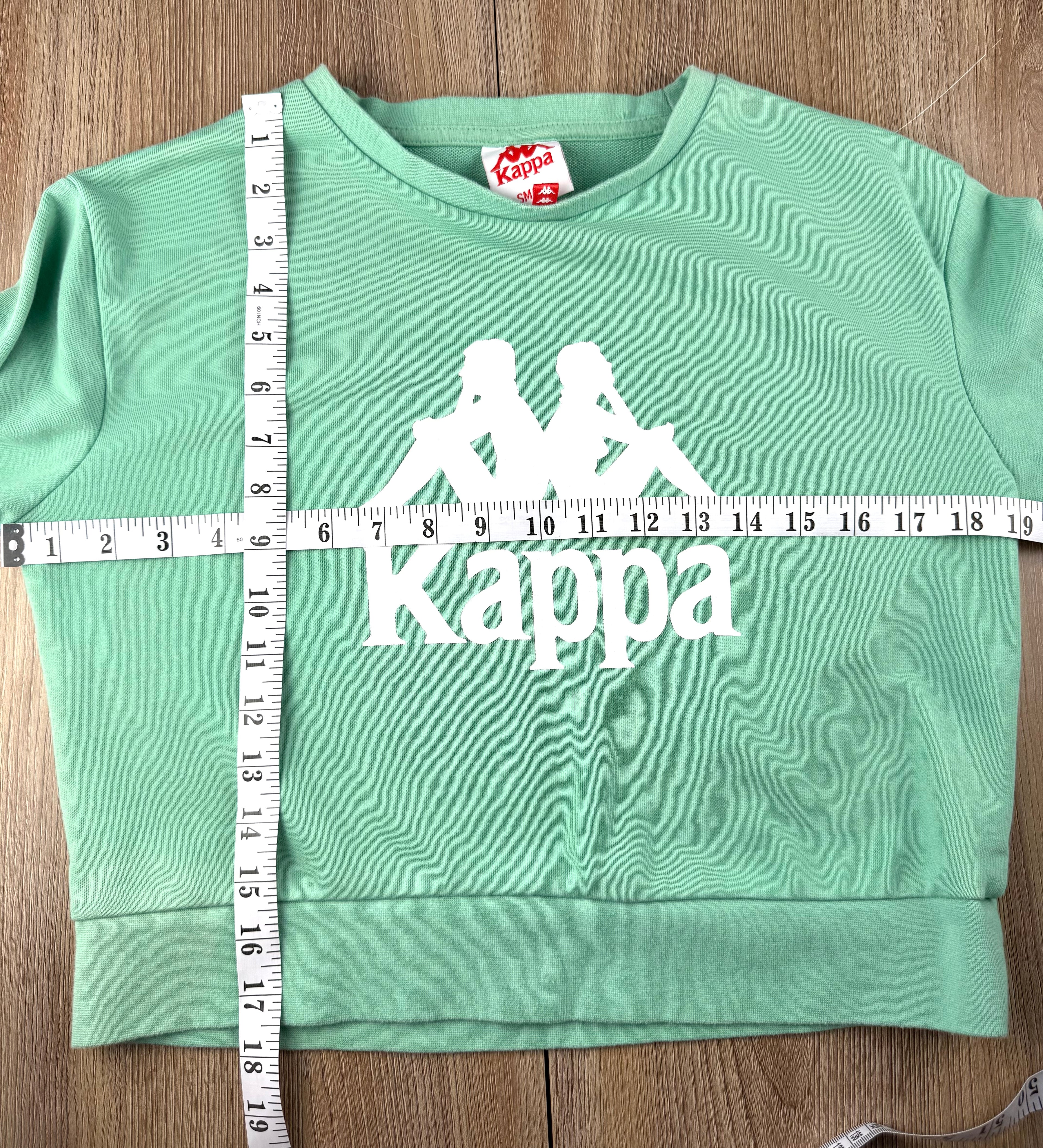 Mint green Kappa cropped sweatshirt inside label 80% cotton sweatshirt measuring 38" bust and 17.5" shoulder to hem