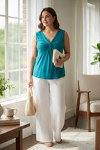 NWT 90% Modal Goddess on the Go Modal Top | Size XXXL at Blue Sparrow Shop on woman standing by a window wearing white linen pants