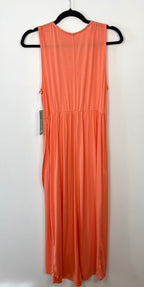 back view of sweet legs coral coloured sleeveless dress on a hanger against a white background