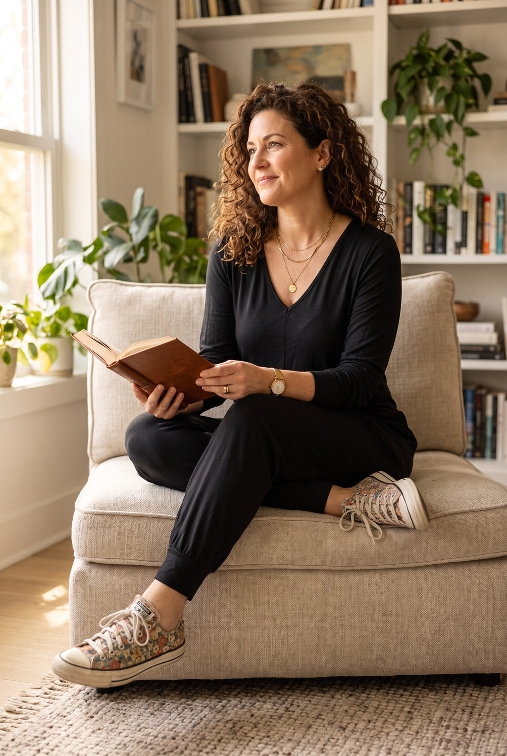 NWT Cotton Smash & Tess Friday Romper | Size M on woman reading book on the edge of living room chair