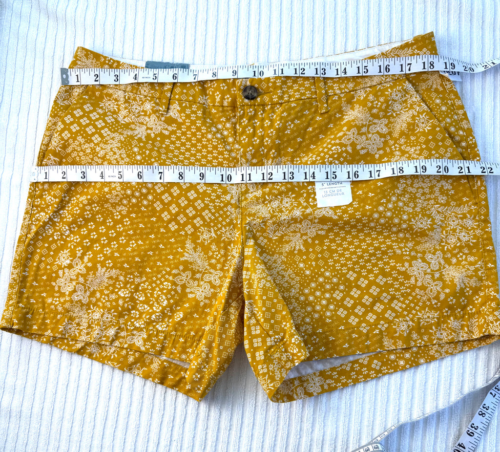 NWT Old Navy 100% Cotton Mustard Floral Print Chino Shorts — 5" | Size 12 at Blue Sparrow Shop measuring 37" waist and 44" hips
