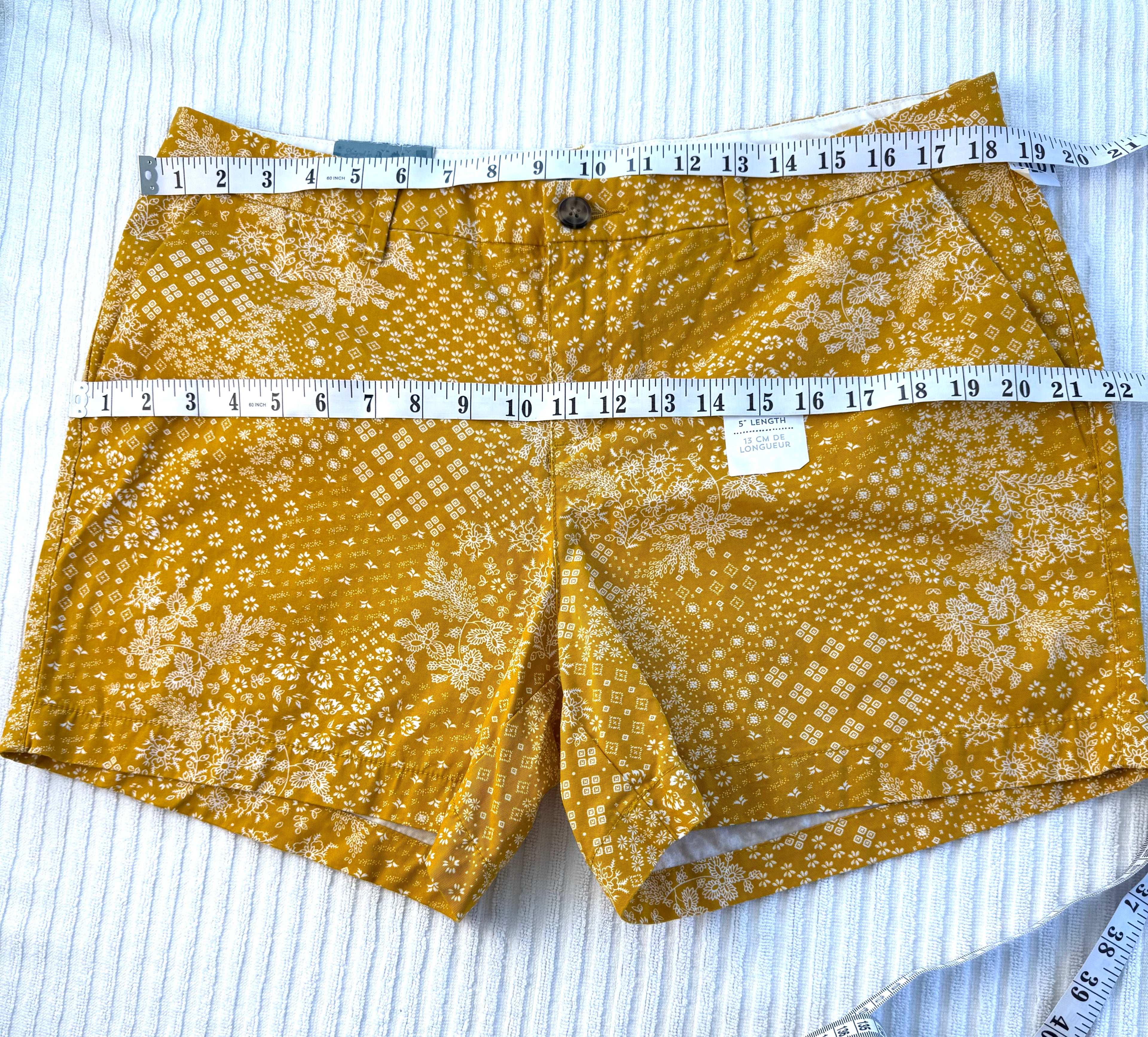 NWT Old Navy 100% Cotton Mustard Floral Print Chino Shorts — 5" | Size 12 at Blue Sparrow Shop measuring 37" waist and 44" hips