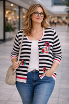 oversized_cardigan_striped_with_sequinned_decals_at_Blue_Sparrow_Shop on woman walking in mall