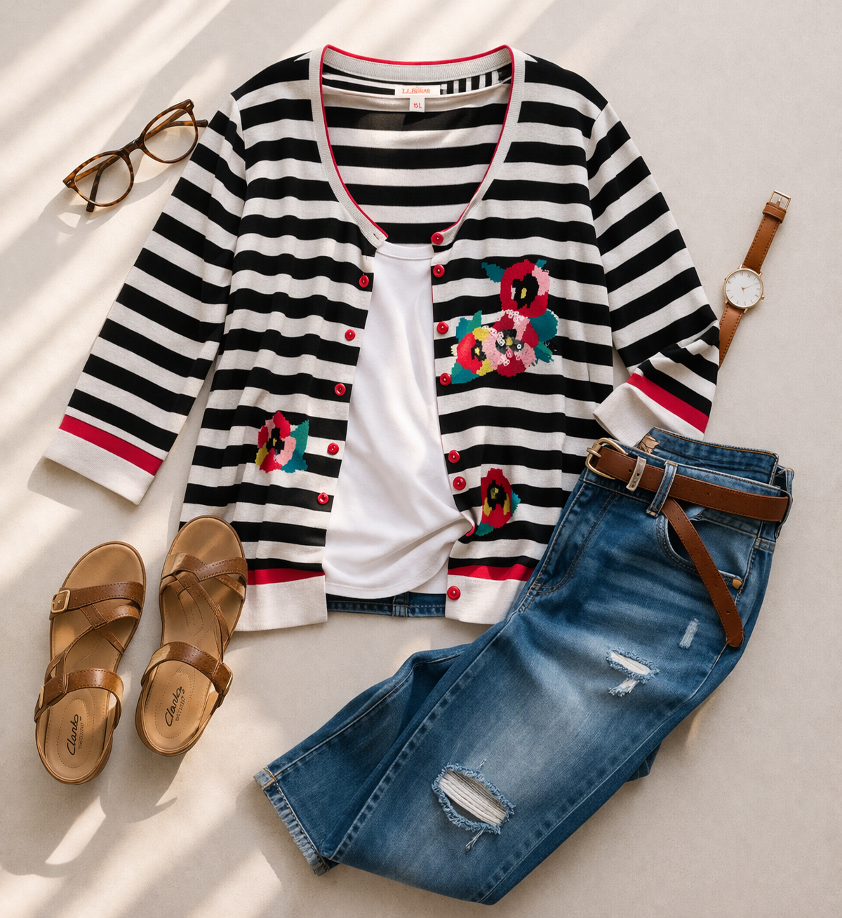 oversized_cardigan_striped_with_sequinned_decals_at_Blue_Sparrow_Shop in flatlay with jeans and shoes