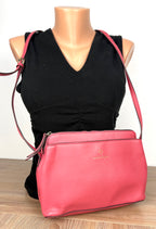 Nanette Lepore Pink Pebbled Leather Crossbody Bag at Blue Sparrow Shop on mannequin to show size 