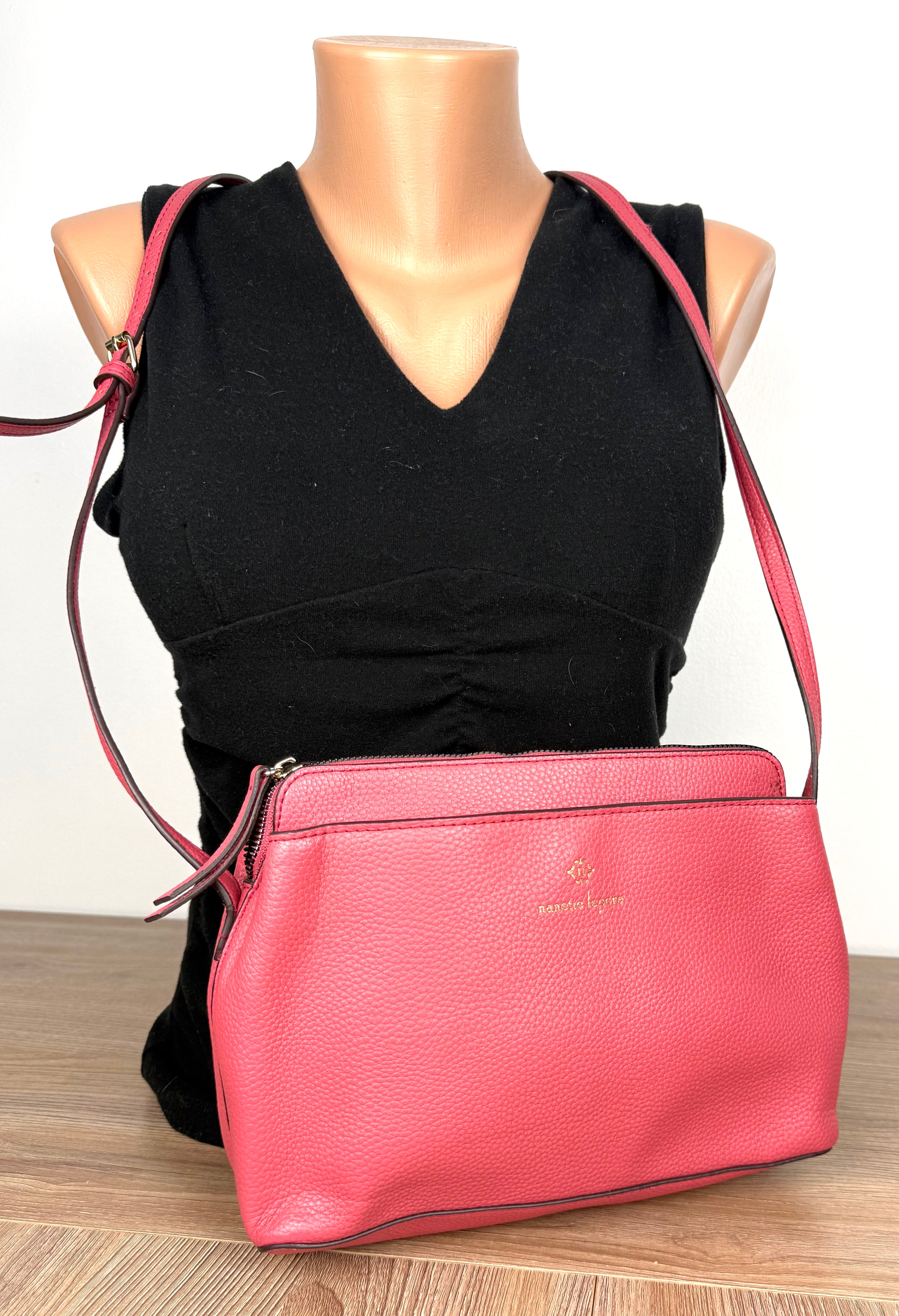 Nanette Lepore Pink Pebbled Leather Crossbody Bag at Blue Sparrow Shop on mannequin to show size 