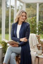 Navy Boho Crochet Open Front Cardigan | Size S at Blue Sparrow Shop  on woman sitting in sunroom reading a book