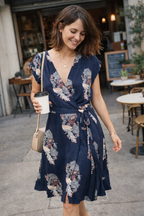 Navy Floral Wrap Dress at Blue Sparrow Shop on woman with coffee outside 