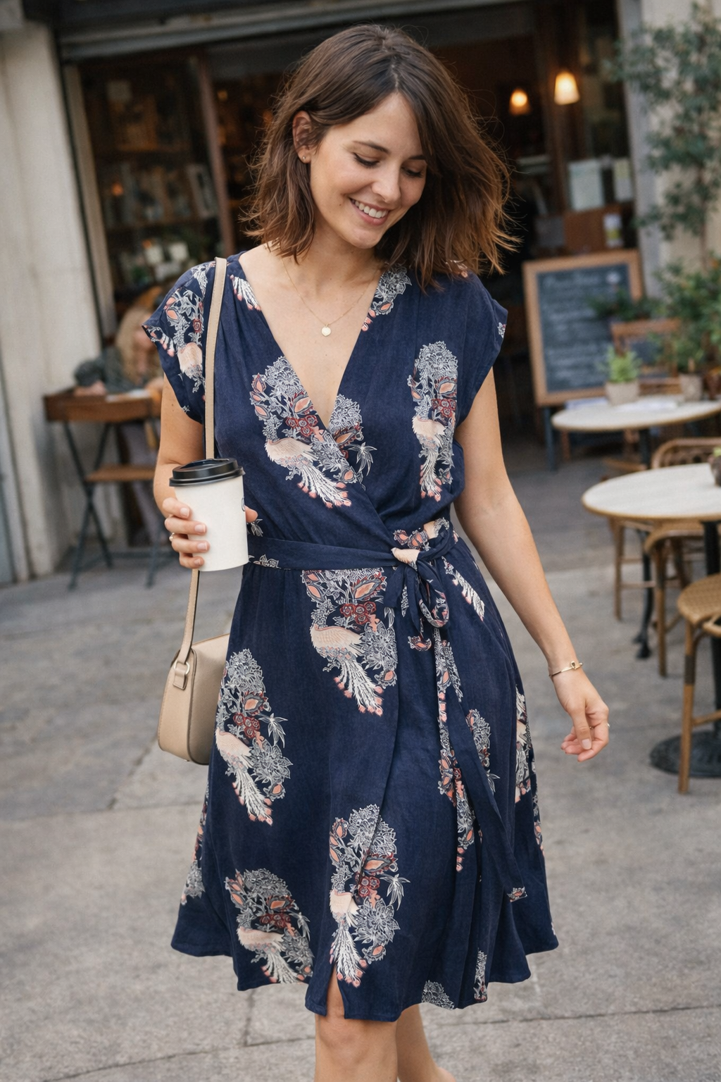 Navy Floral Wrap Dress at Blue Sparrow Shop on woman with coffee outside 