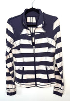 navy and cream striped Lululemon sweater with high collar and zip pockets.