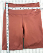 Nike Dri-FIT Terracotta Biker Shorts | Size M  at Blue Sparrow Shop measuring 26" waist and 17" waist to hem 